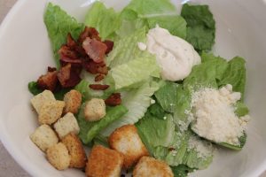 How To Make Caesar Salad - mix together